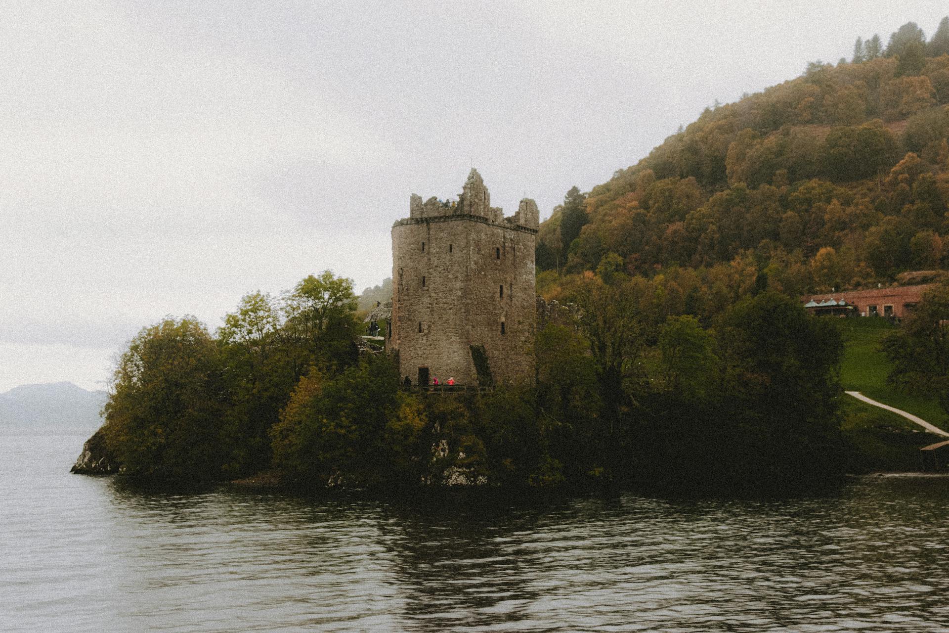 Urquhart Castle, seen from the dark waters of Loch Ness.